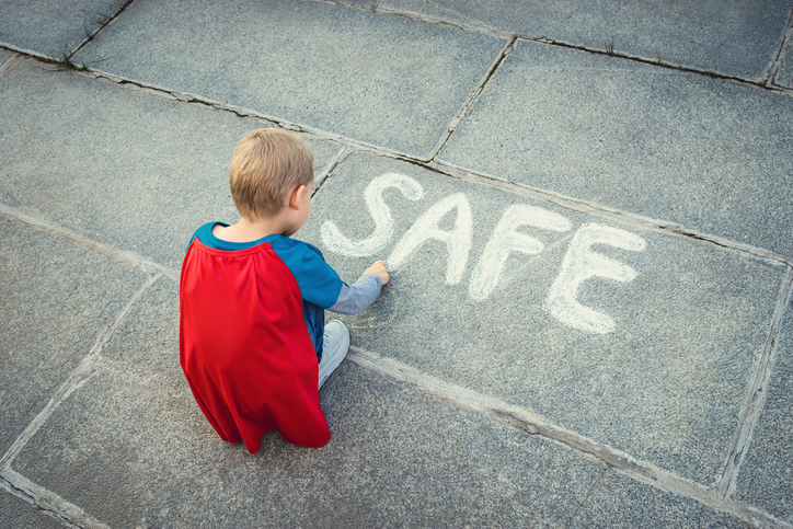 Little boy with inscription 'safe'